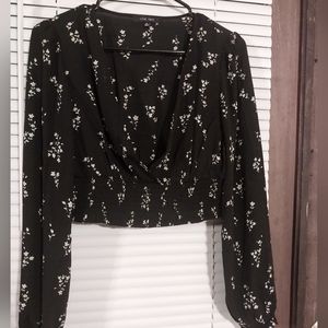 Flower, smock waisted, long sleeved, a little see thru sexy and fun! Black tranl